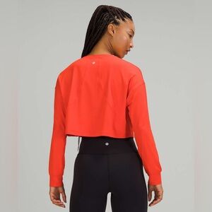 Lululemon Muscle Love Long Sleeve cropped orange athletic shirt size medium?